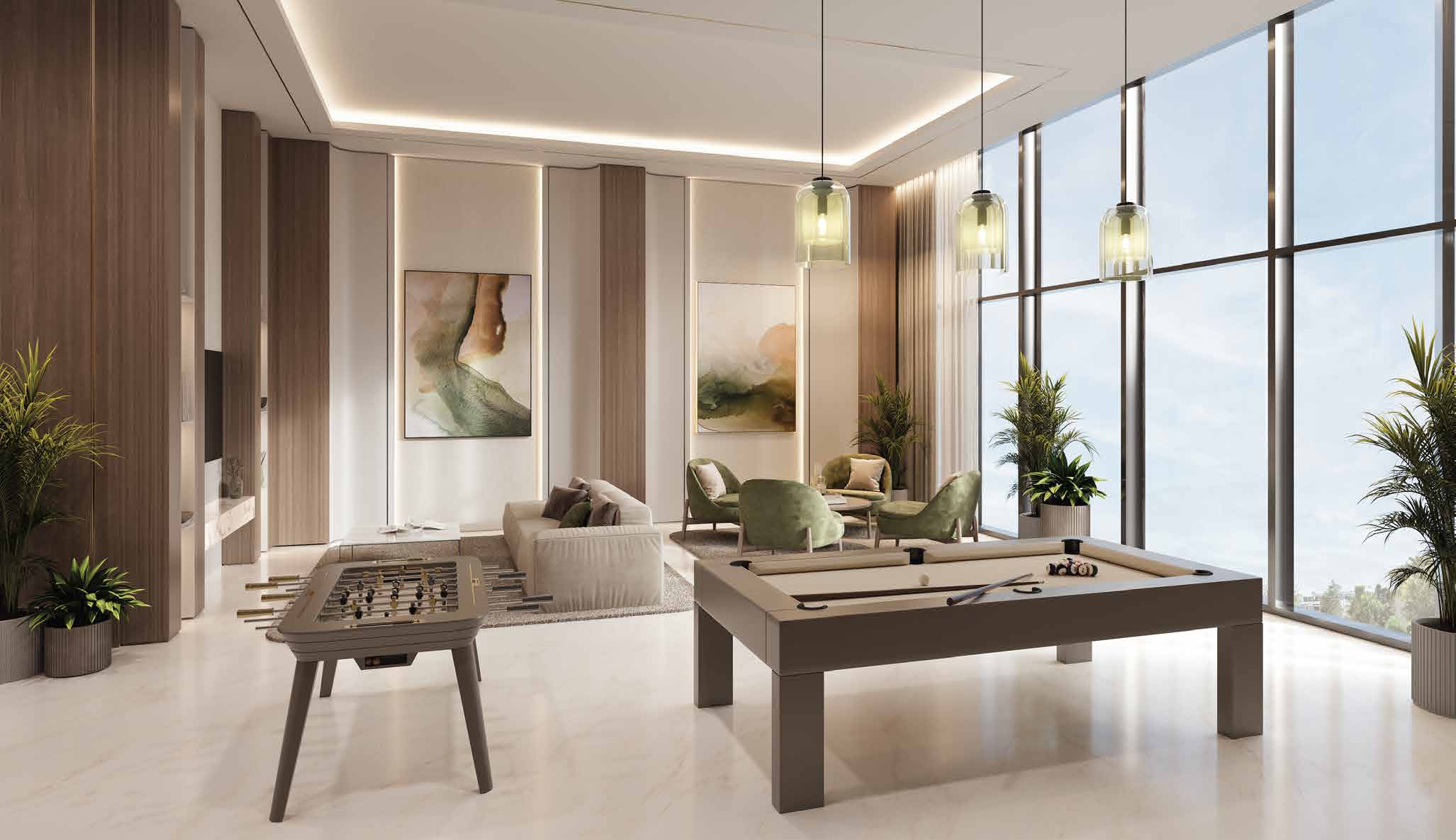 Entertainment room with pool table, foosball and green armchairs