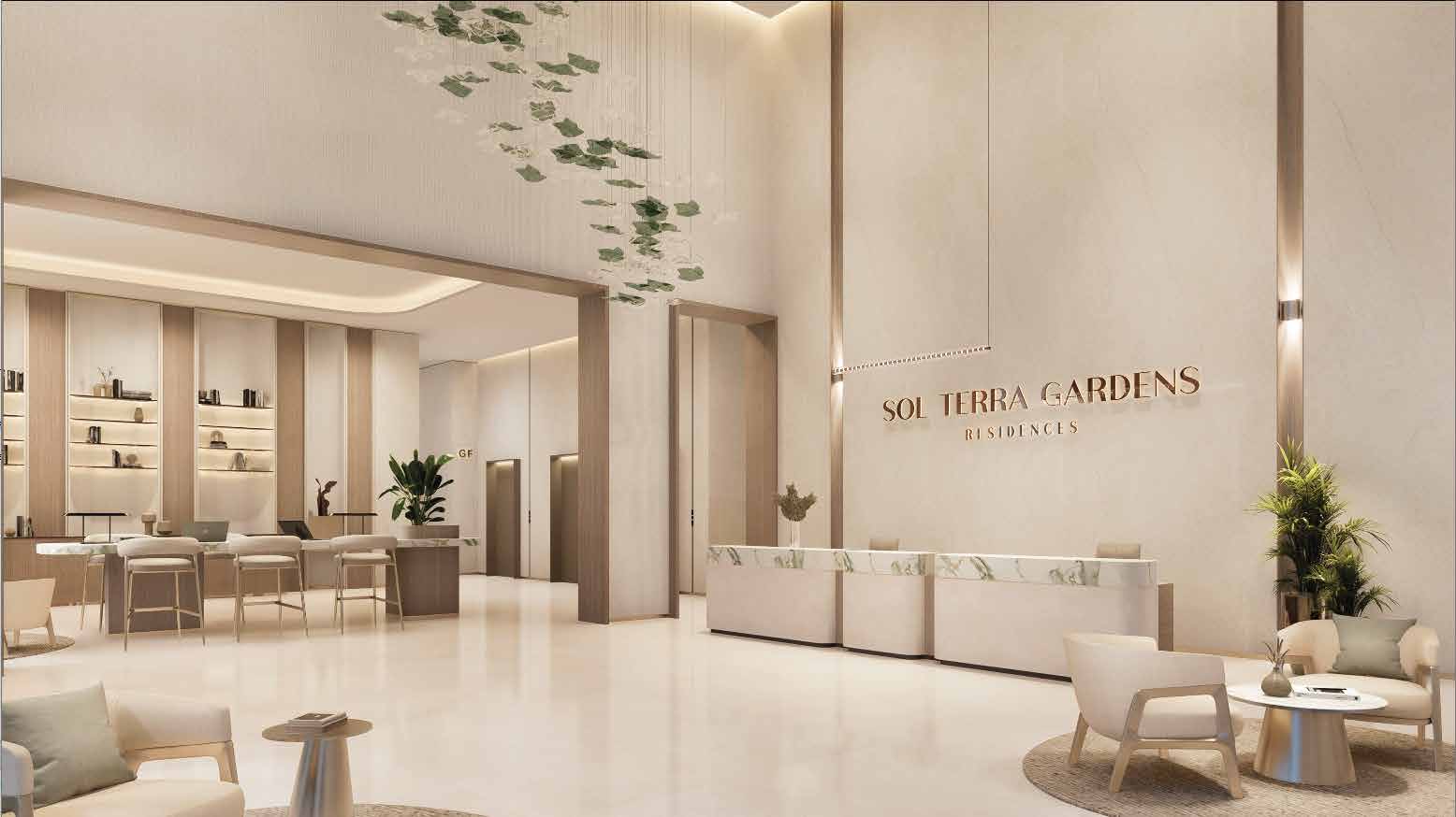 Double-height lobby with marble reception desk and leaf chandelier