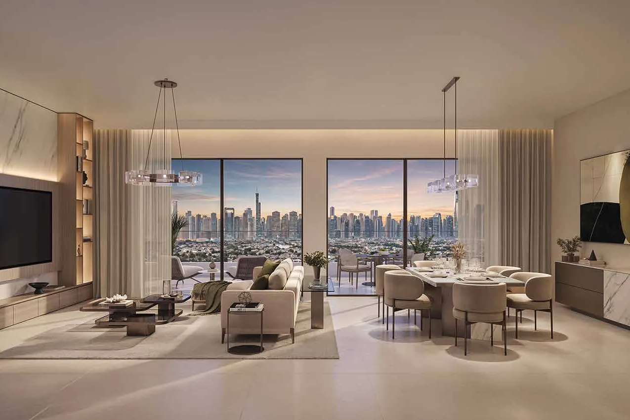 Living room at dusk with sofa, dining table and city skyline beyond
