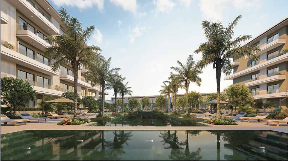 Still courtyard pool reflecting palms between the residential wings